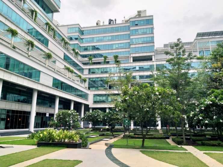 Green courtyard and glass buildings at IIT Madras Research Park